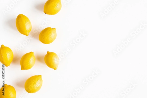 Fototapeta Lemons on white background. Flat lay, top view