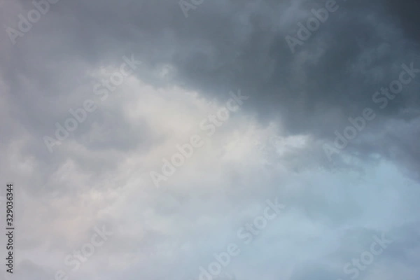 Obraz Blurred dramatic sky background. Exciting dark stormy clouds before rain