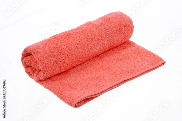 Fototapeta coral twisted towel on a white background isolate