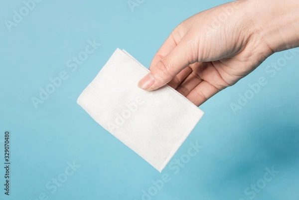 Fototapeta One hand is testing the tenacity of a tissue