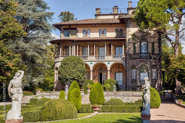 Fototapeta Old mansion and garden near it