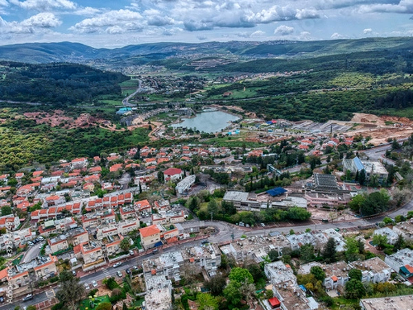Fototapeta Aerial view of Maalot , Israel with water and communication tower in sight 