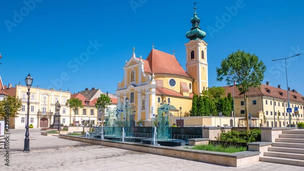 Fototapeta The Carmelite Church of Gyor is one of the most important historic churches of the city, the most important building in the cityscape of the Vienna Gate Square.