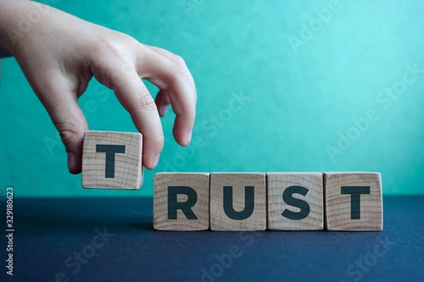 Fototapeta TRUST word made with building blocks.