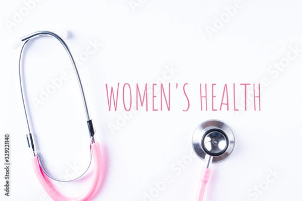 Obraz Pink stethoscope isolated on white with WOMEN’S HEALTH wordings