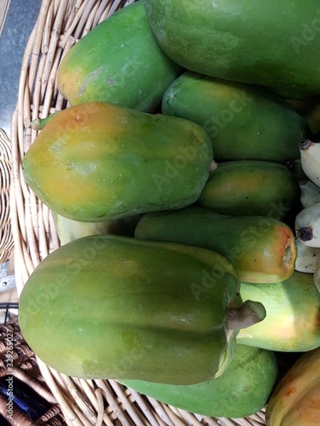 Obraz Closeup of papayas in basket for sale in the market.  Recommended nutritious fruit concept.