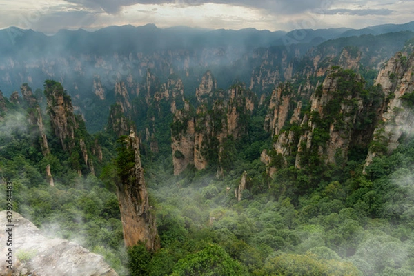 Obraz Foggy panorama of mountain range in Yellow Stone Stronghold (Huangshi Zhai) in Yuanjiajie Scenic Area , Zhangjiajie National Park, China