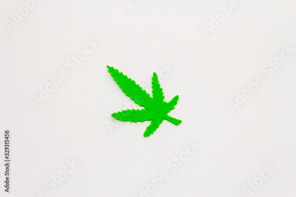 Fototapeta Felt hemp leaf isolated on white background