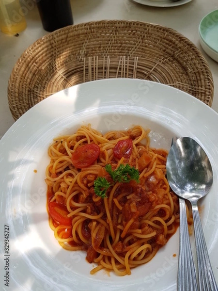 Obraz Closeup of delicious spaghetti with minced pork in tomato sauce.  Popular food concept.