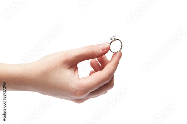 Obraz Hand on a white background. Ring in the hand. Big Stone Ring