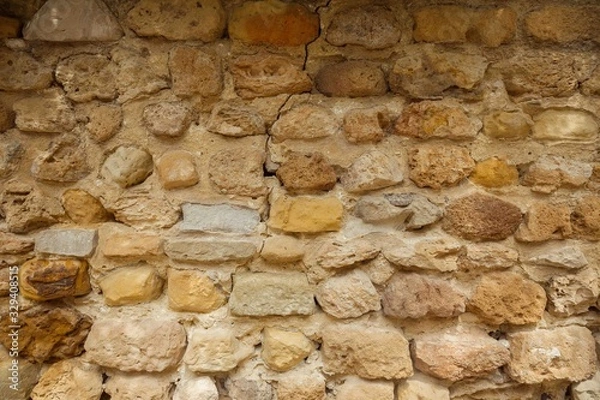 Obraz Old limestone brick wall. Yellow stone wall texture.