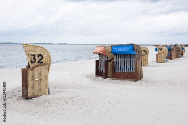 Fototapeta Beach chairs (Strandkorb) at the Baltic Sea in Laboe, Germany