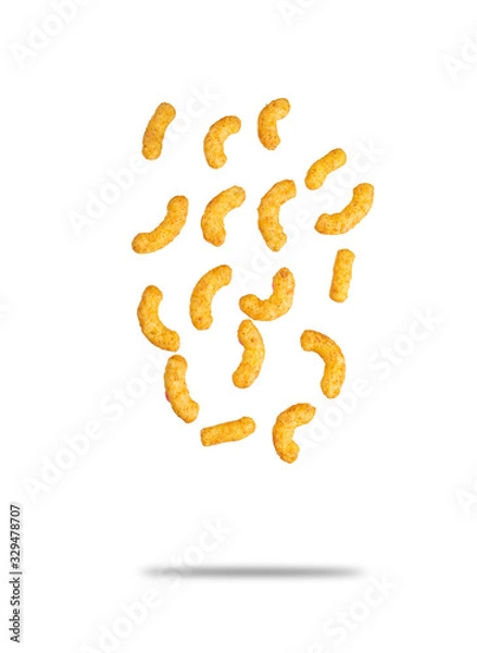 Fototapeta Puffed corn peanuts snacks falling. Isolated on white background with shadow. Selective focus.