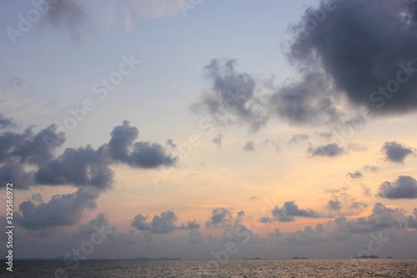 Fototapeta Clouds and morning sky on the sea.white clouds over the tropical sea at sunset.