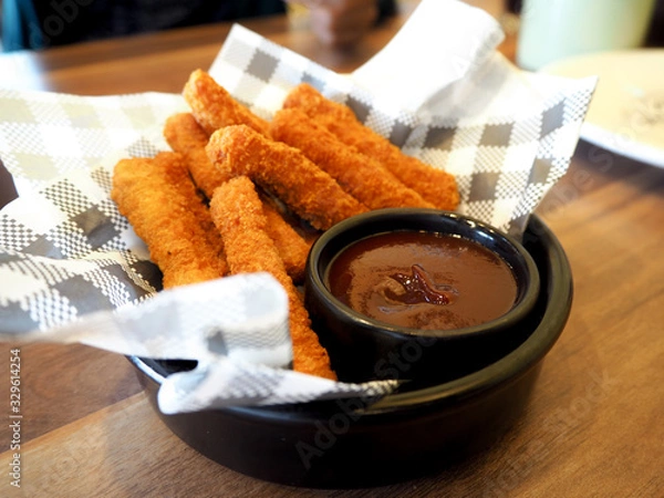 Fototapeta fried chicken stick with sauce on table