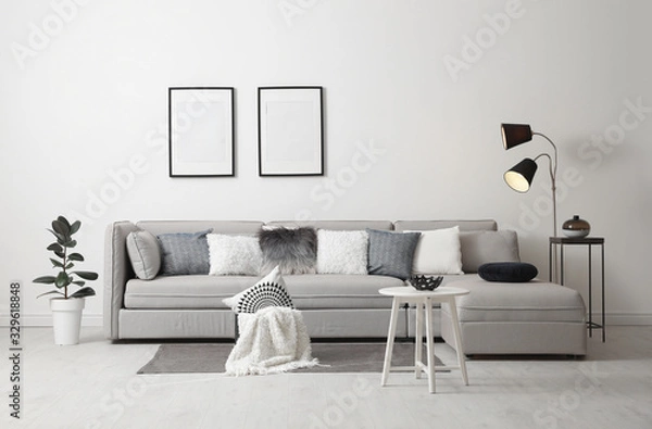 Fototapeta Stylish living room interior with comfortable sofa