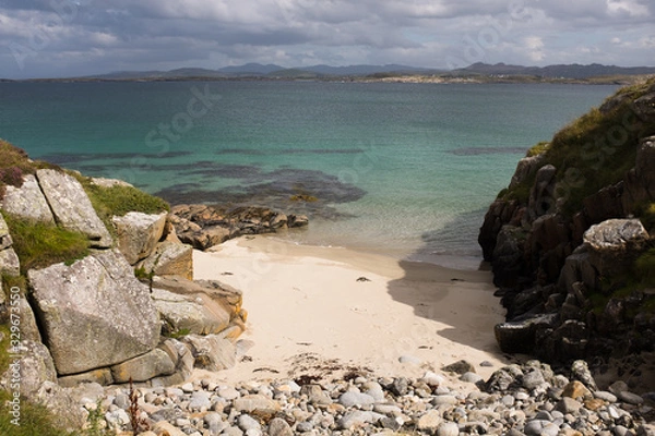 Fototapeta Beach covered in rocks in Ireland