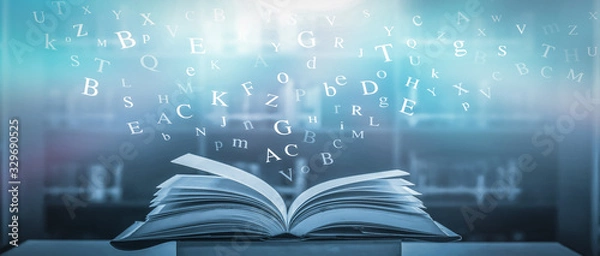 Obraz 	 The concept of education by planting a tree of knowledge in the opening of an old book in the library and the magical magic of light that flies to the destination of success. Beautiful background