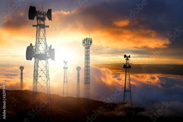 Fototapeta Telecommunication pole With a sunset background