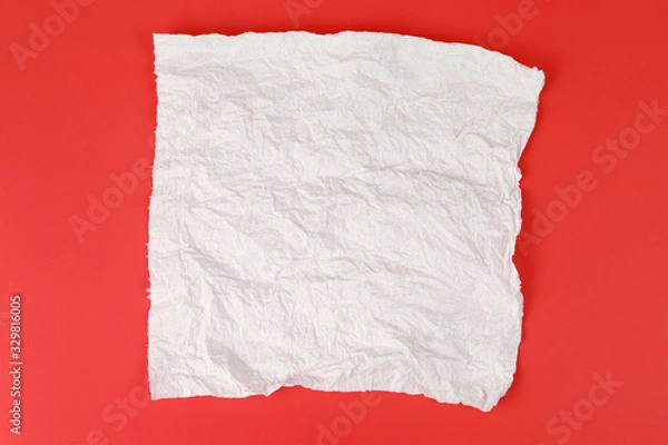 Fototapeta Crumpled paper towel on red background