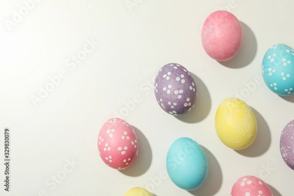 Fototapeta Multicolor Easter eggs on white background, space for text