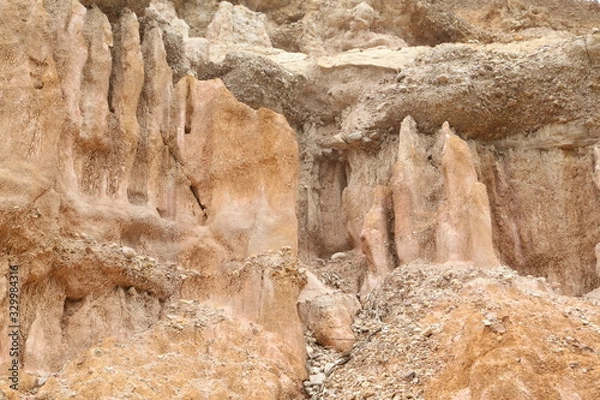 Fototapeta Background of rocks from clay and stone after a landslide