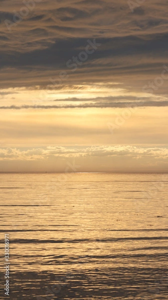 Obraz Yellow sunset on the Arctic Ocean in dark tones