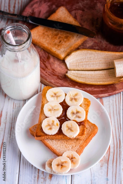 Fototapeta Fresh toast with salted caramel and banana.