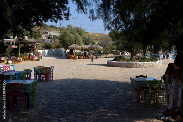 Obraz Arkoi island, restaurants surrounding the small harbor, early in the morning, Dodecanese Islands, Greece
