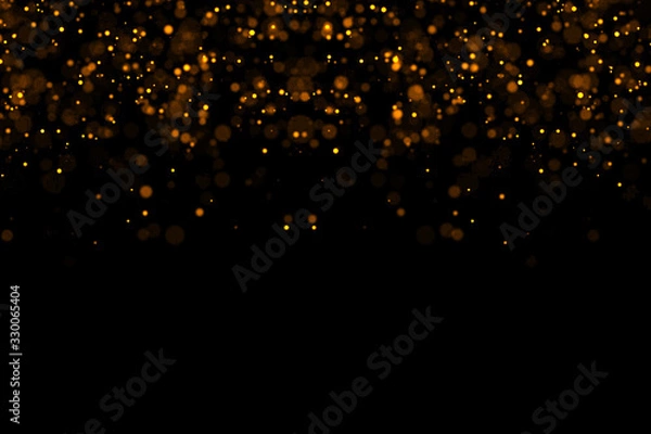 Fototapeta waterfalls of golden glitter sparkle bubbles champagne particles stars on black background,happy new year holiday