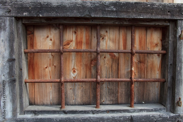 Obraz Cravegna (VCO), Italy - December 19, 2017: An old window with a iron grate, Vigezzo Valley, VCO, Piedmon, Italy