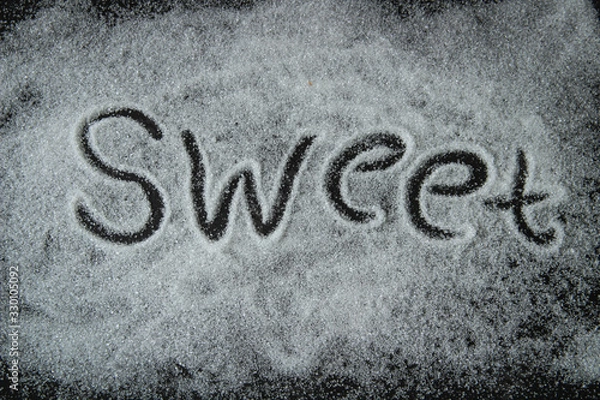 Obraz sweet, the test is written with sugar on a black background