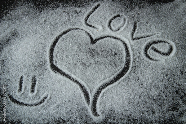 Obraz heart, word love, smiley, sugar are depicted on a black background, день святого Валентина