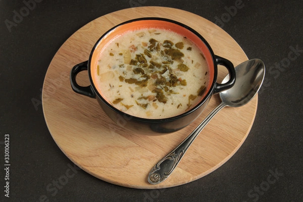 Obraz Armenian milk soup, entitled spas, on a wooden board with a spoon