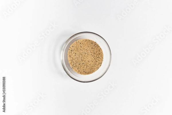 Fototapeta amaranth seeds heap in glass bowl isolated on white background