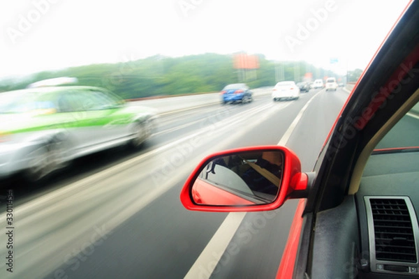 Fototapeta shoot from the window of rush car,motion blur steet