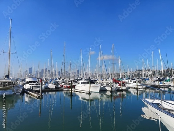 Fototapeta harbor with yatch under blue sky