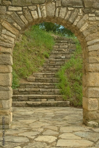 Obraz old stone staircase witn an arch