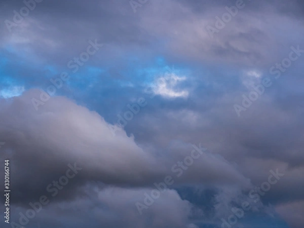 Fototapeta Dramatic clouds before sunset - fluffy like cotton candy