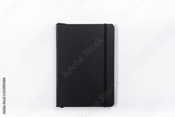 Obraz black notebook on white background with clipping path