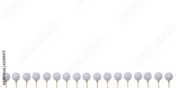 Fototapeta Golf balls lined up and ready to hit