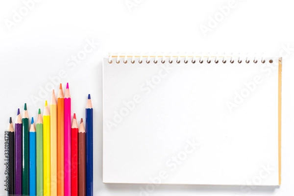 Fototapeta notepad with color pencil on white table view from above