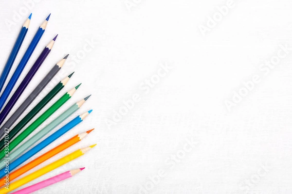 Obraz Flat lay composition with color pencils on light wooden background. Free copy space. Top view.