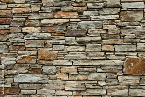 Fototapeta Otago schist stone wall texture. Background pattern.