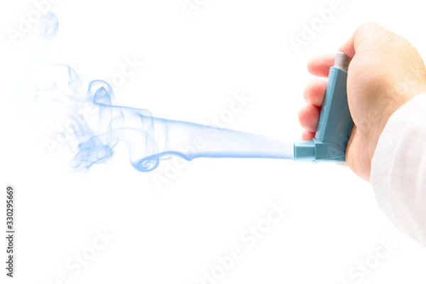 Fototapeta hand with an asthma inhaler on a white background