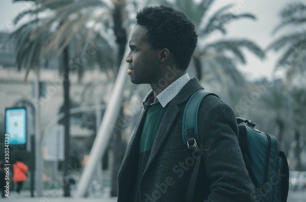 Obraz A young black student with a bag in his shoulder