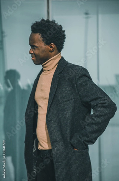 Obraz Black businessman smiling near to a building