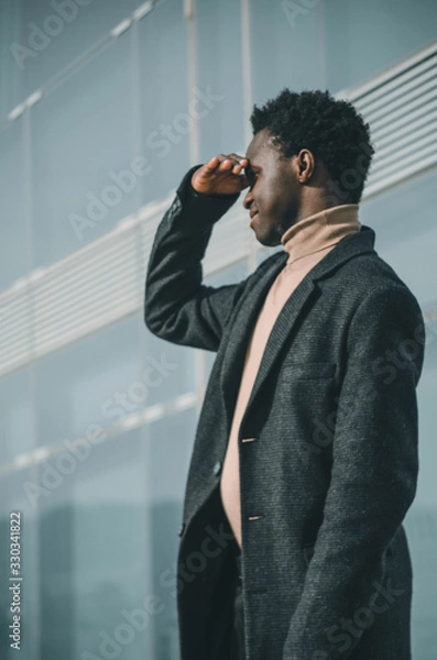 Obraz businessman looking towards the horizon with his hands