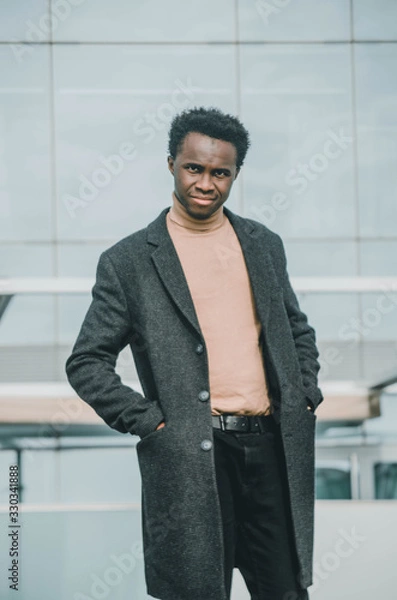 Obraz portrait of man standing in front of a building