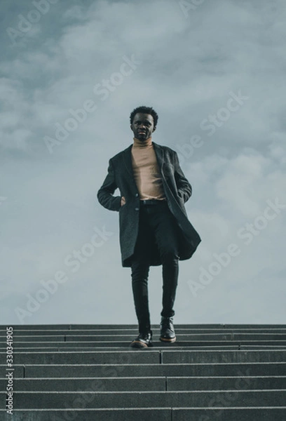 Obraz businessman on a blue sky background 